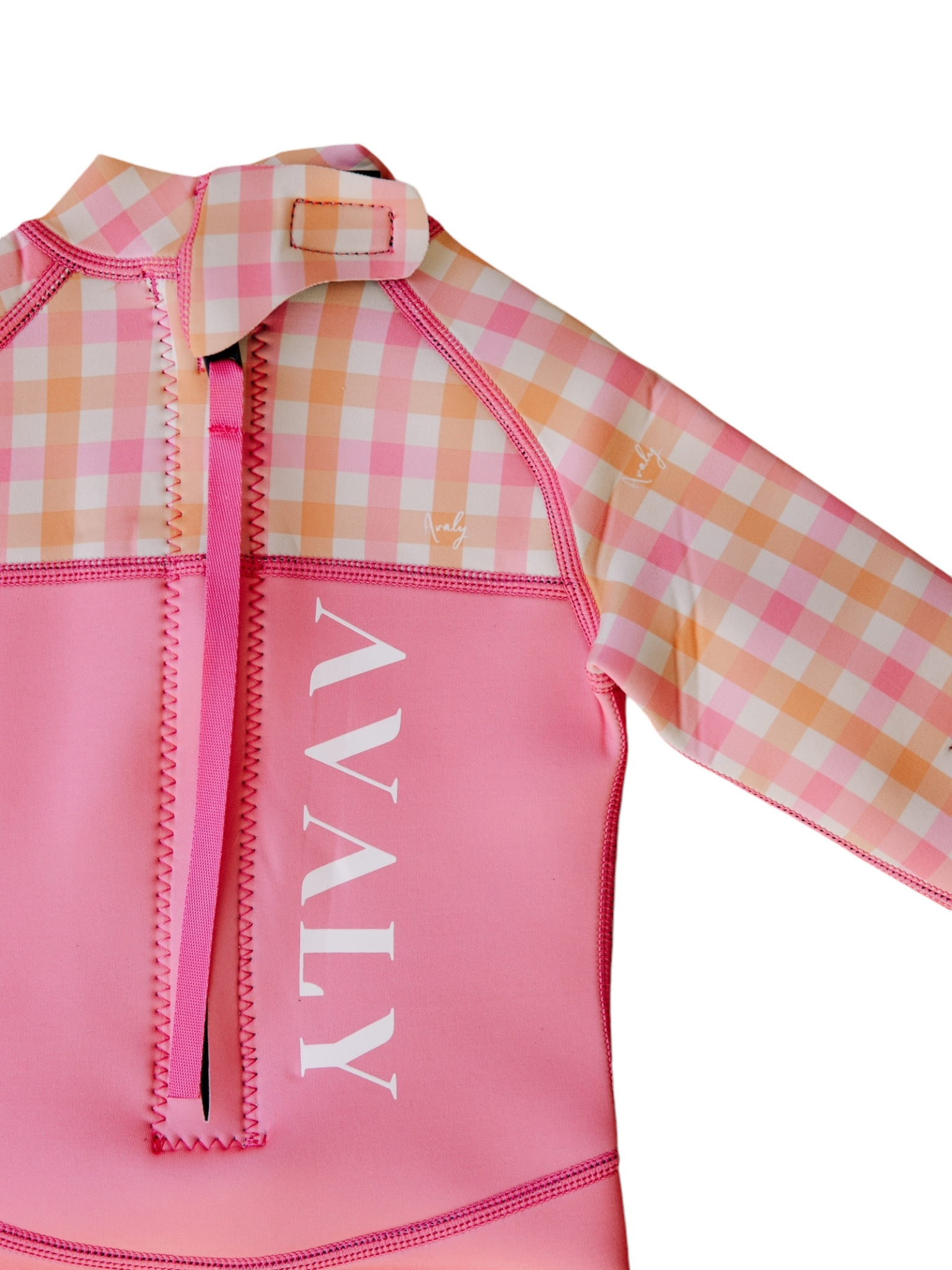 Detail shot of Pink & Orange Gingham Kids Wetsuit showing checkered sleeve pattern and front zipper with AVALY branding