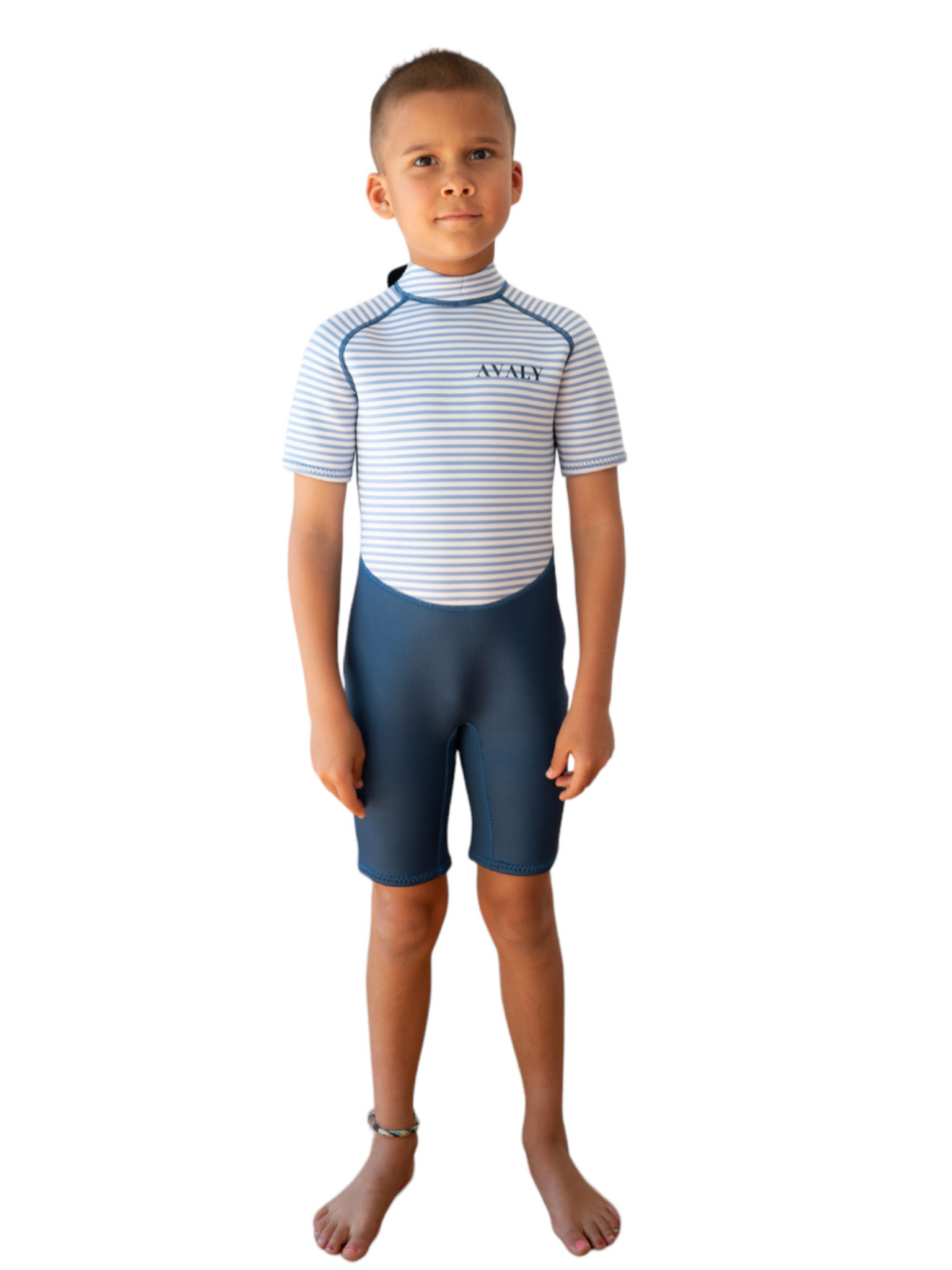 Child model wearing Navy Stripe Kids Wetsuit with blue and white striped top and navy shorts