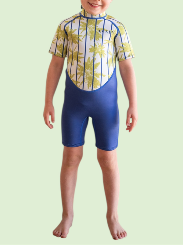 Child wearing Blue Palm Kids Wetsuit in navy with yellow palm tree striped print on torso and short sleeves