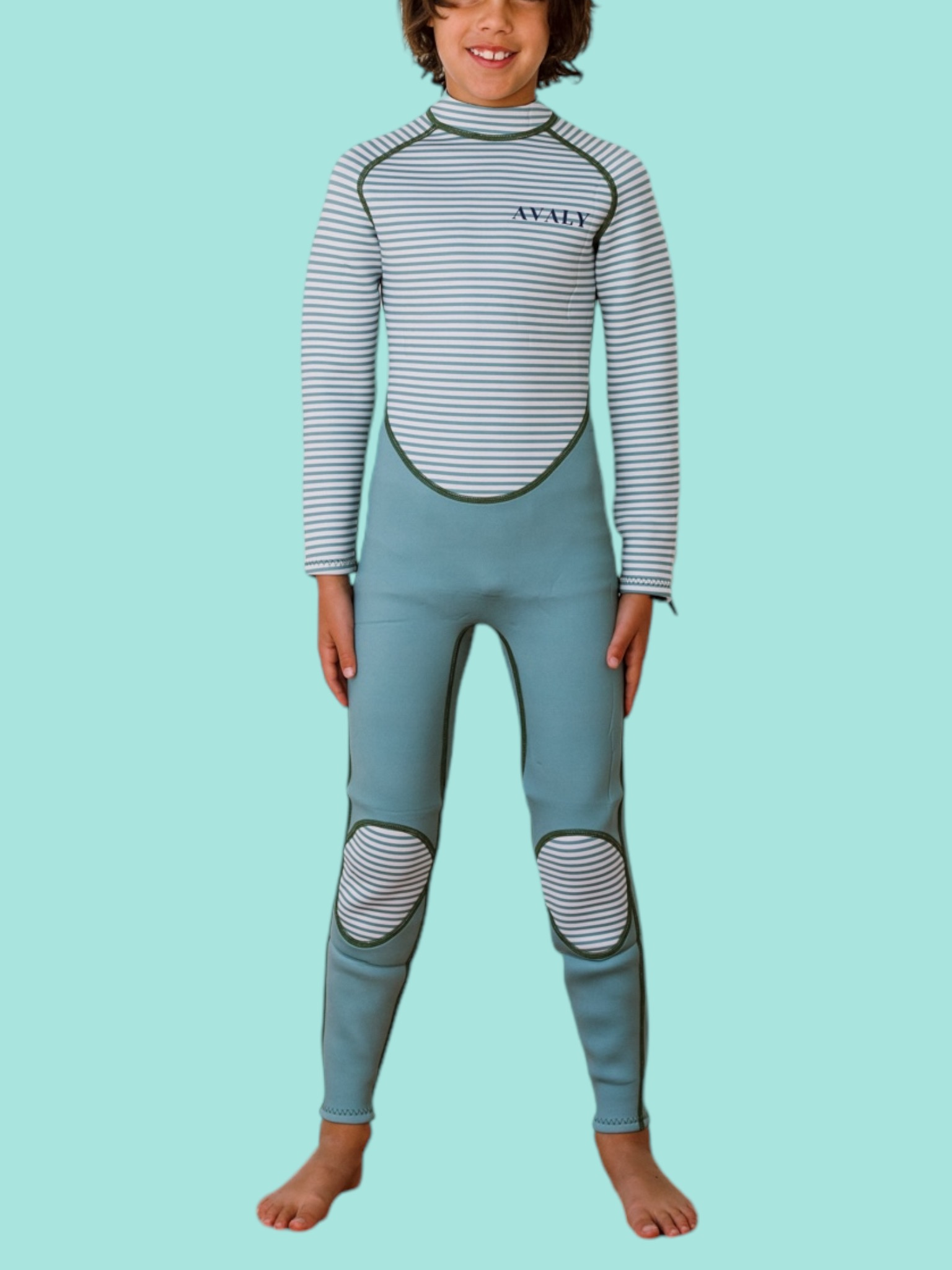 Child model wearing Green Striped Kids Sustainable Wetsuit with blue gray body and white striped panels on torso, arms and knees