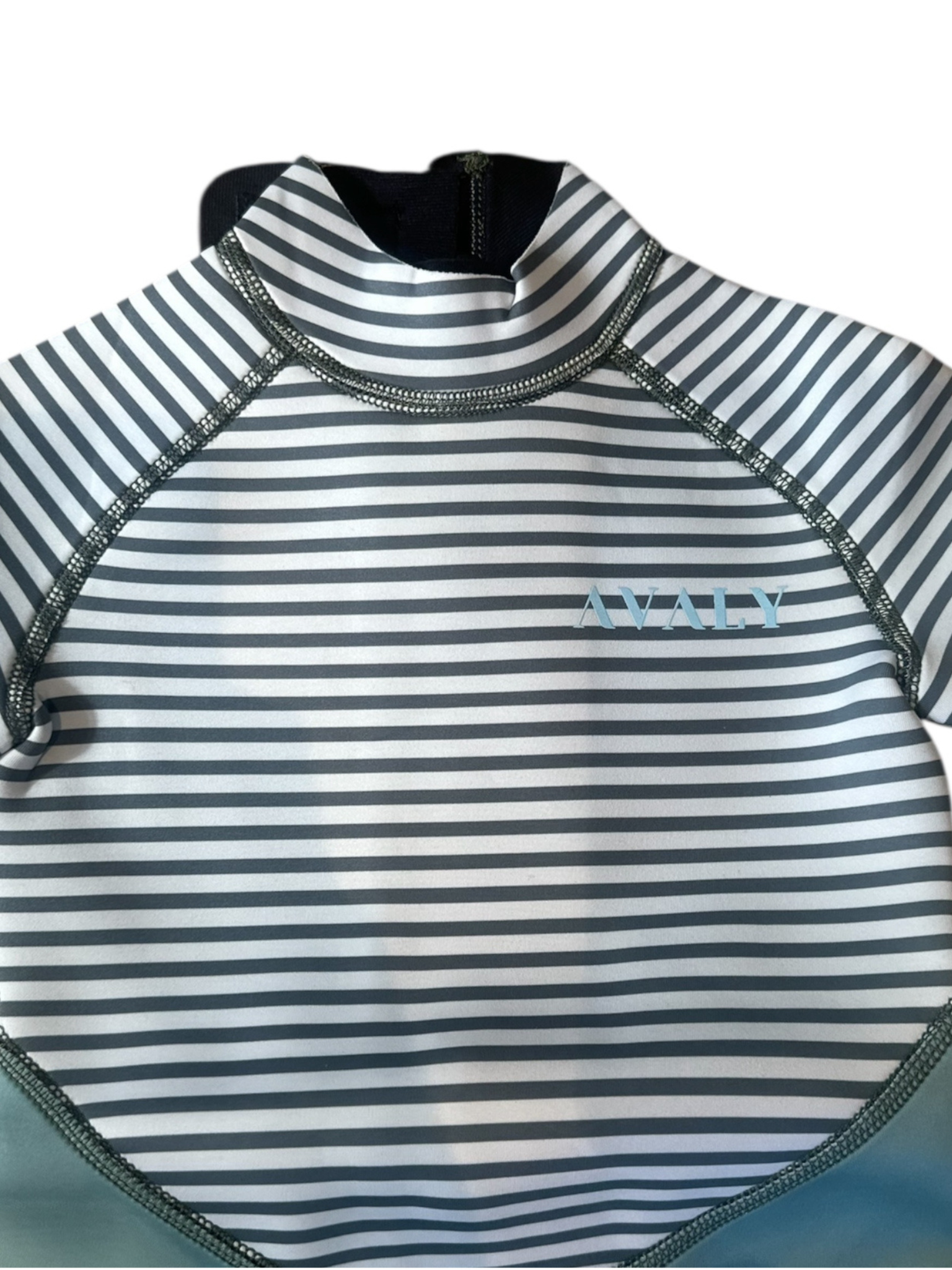Close up detail of sage and dark green striped wetsuit showing horizontal stripes and AVALY logo on chest
