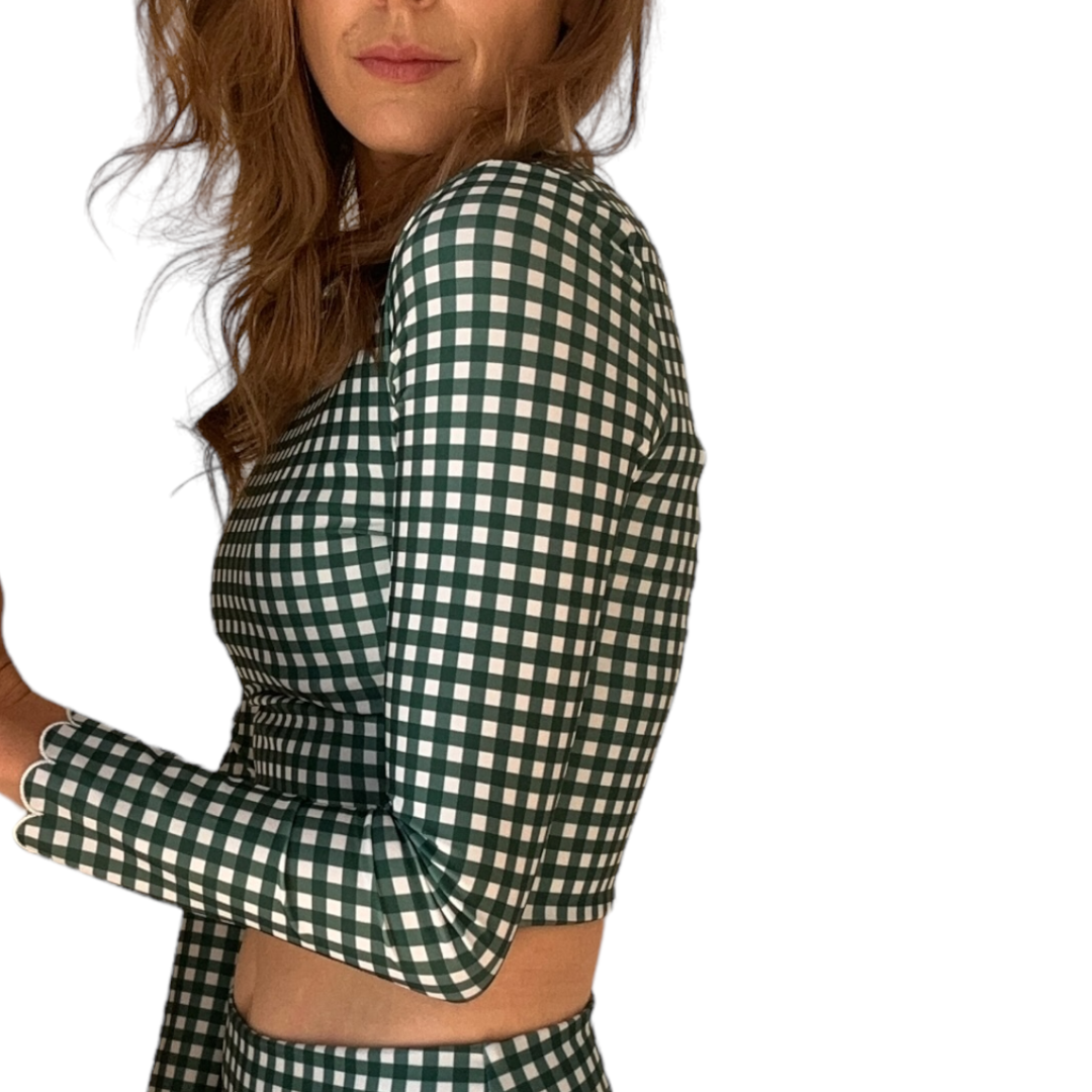 Side view of woman wearing Green Gingham Midi Rash Top showing checkered pattern and cropped length