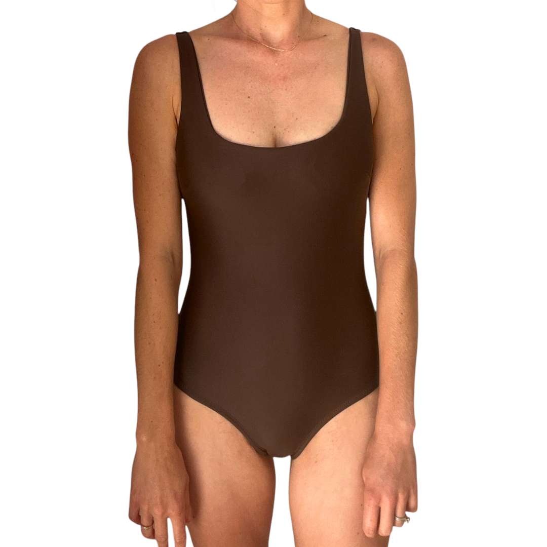 Front view of woman wearing brown Chocolate One Piece swimsuit with scoop neckline and tank straps