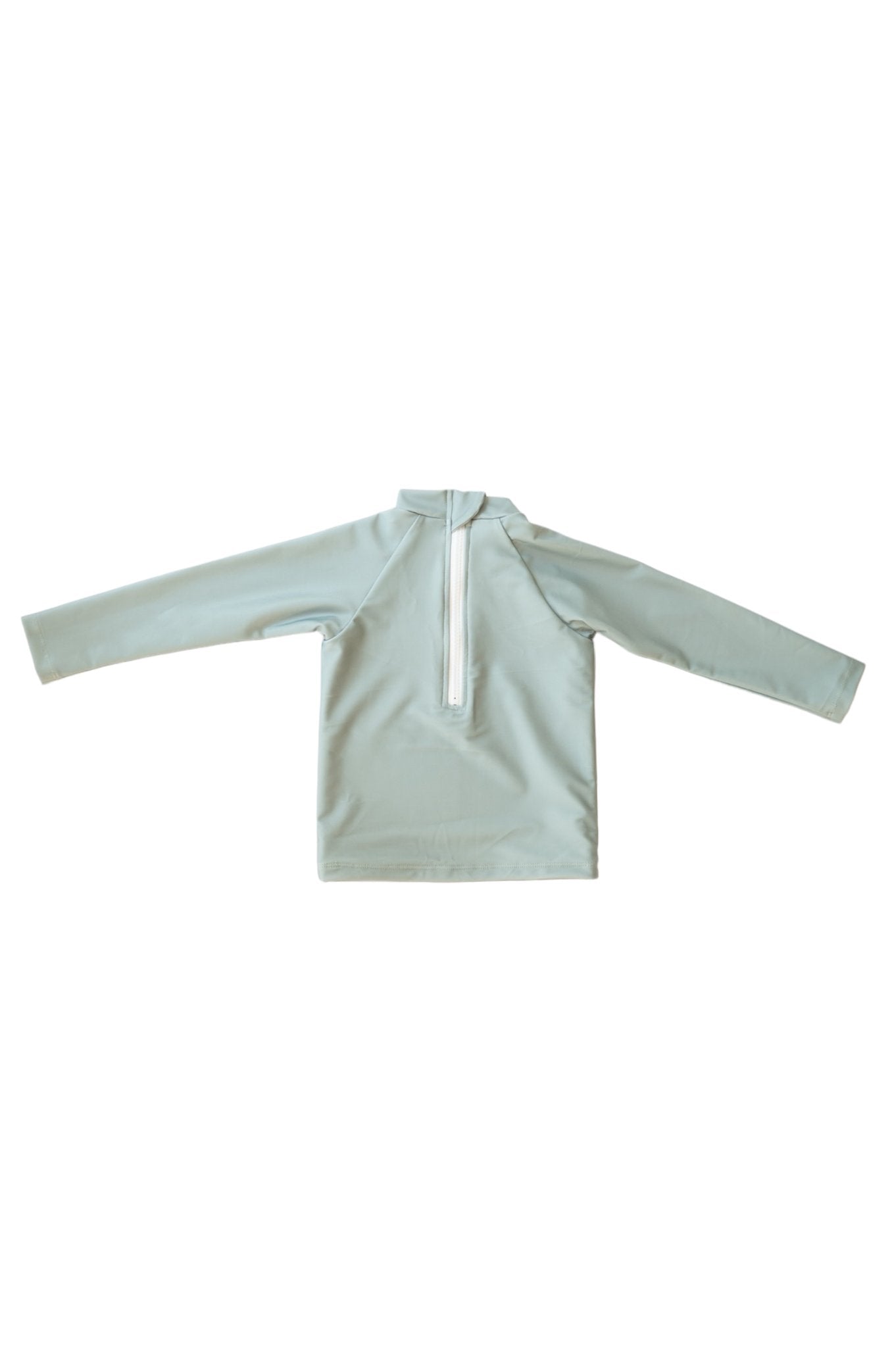 Flat lay of Sage Manly Sustainable Rash Top in mint green with white quarter zip and hood