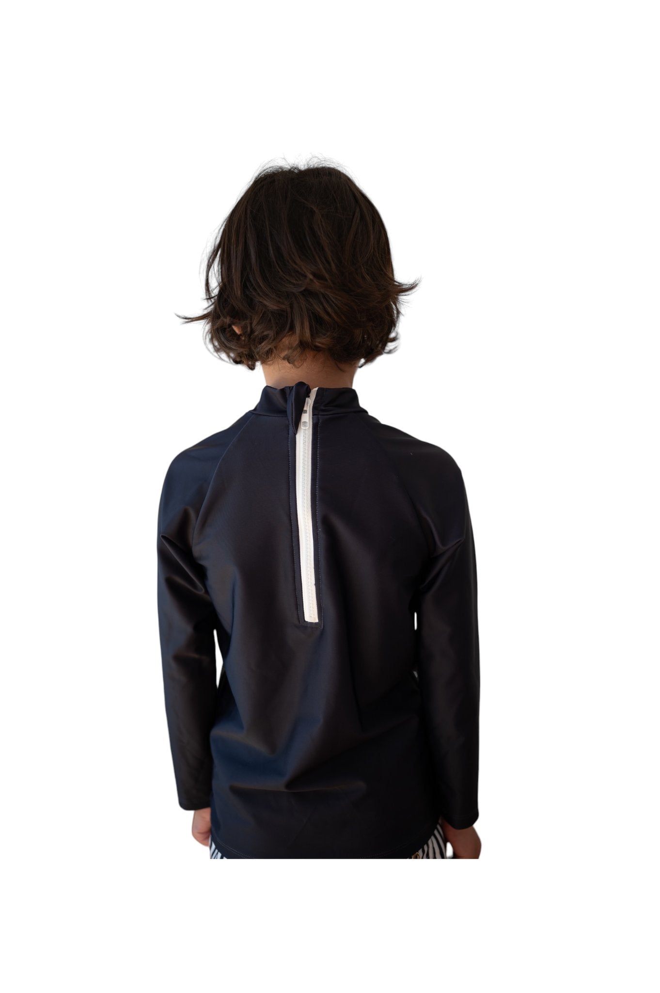 Back view of child wearing Navy Rash Top Byron showing white contrast zipper and relaxed fit