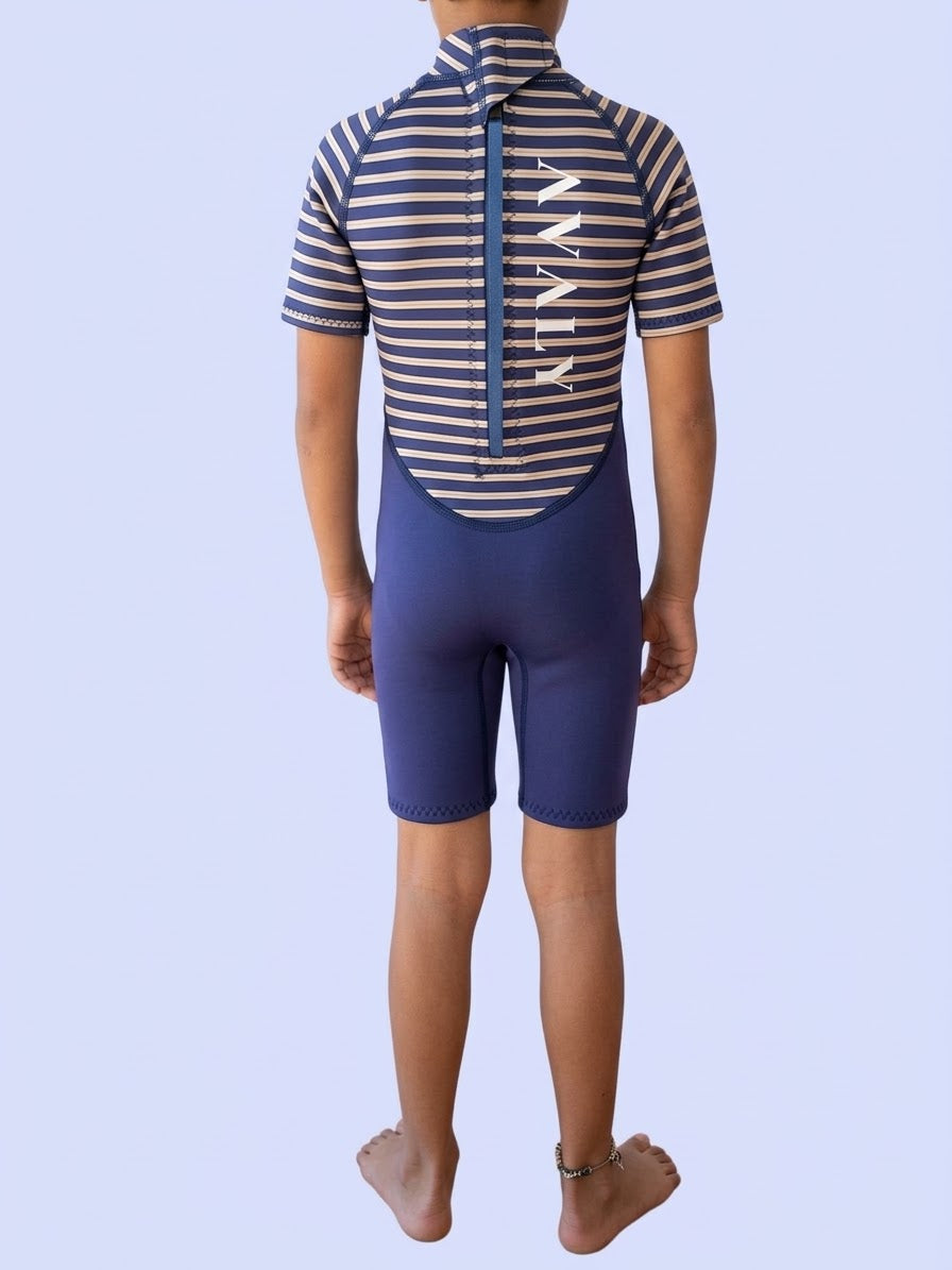 Back view of the Blue Stripe Kids Wetsuit showing the back zip, vertical AVALY logo and solid navy shorts