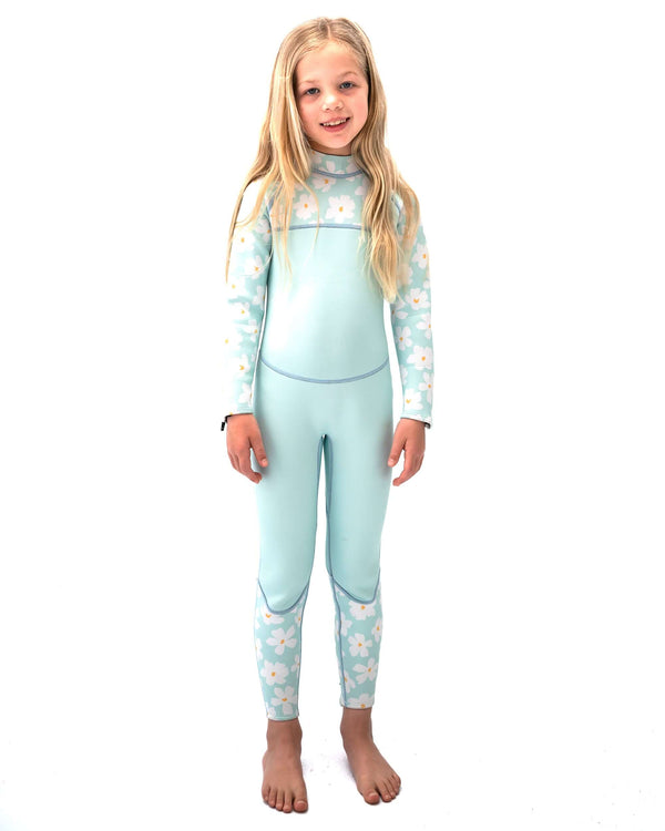 Girl wearing Mint Green Daisy Tallow wetsuit with floral print sleeves and legs, mint solid torso, standing on white background